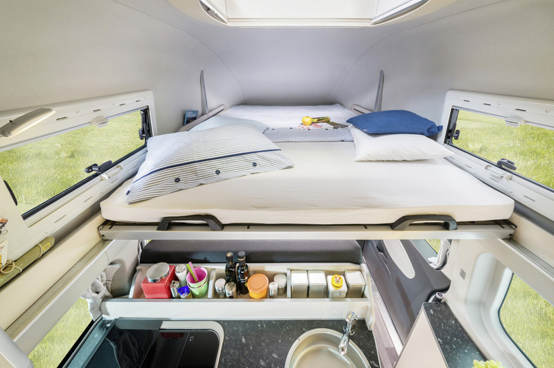 Illustration for article titled This Ingeniously Packaged Camper Packs Four People In A Tiny Van